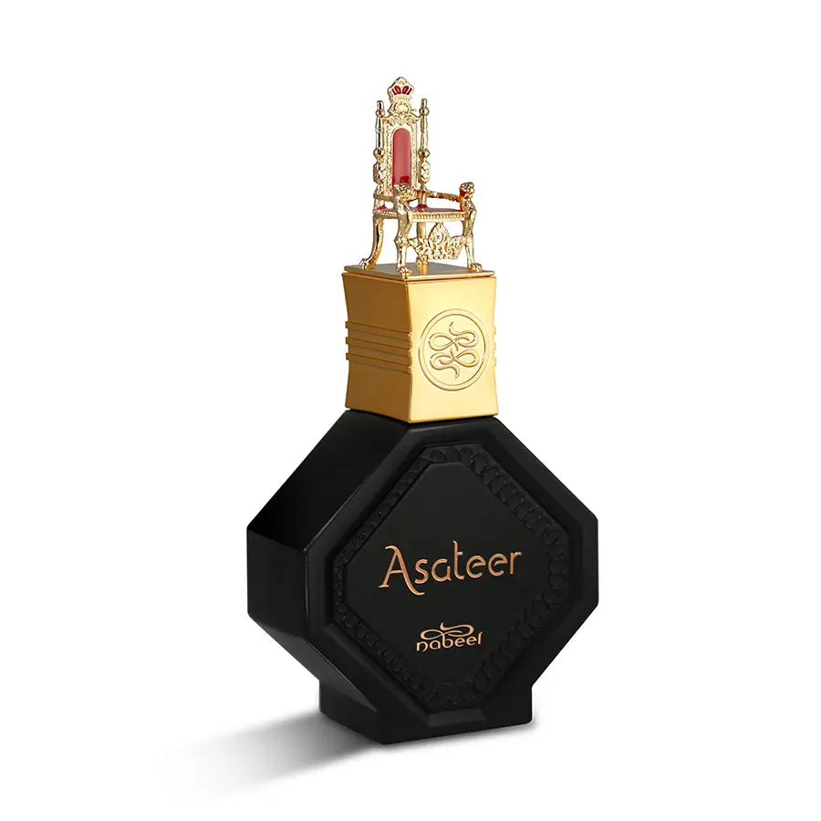 The image features an intricately designed perfume bottle labeled "Asateer" by Nabeel Perfumes. The bottle has a distinctive hexagonal shape with a black matte finish and gold lettering. The cap is gold-colored and topped with an ornate miniature golden throne with red accents, which adds a regal touch to the design. The branding "nabeel" is subtly placed below the perfume's name on the bottle.