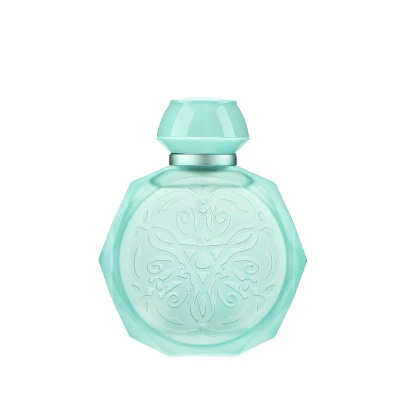 A pastel blue octagonal perfume bottle with intricate embossed designs on the front. The bottle features a matching pastel blue cap and a silver collar, adding a touch of elegance and sophistication. The soft blue color and detailed patterns give the bottle a delicate and luxurious appearance, perfect for a high-end fragrance.