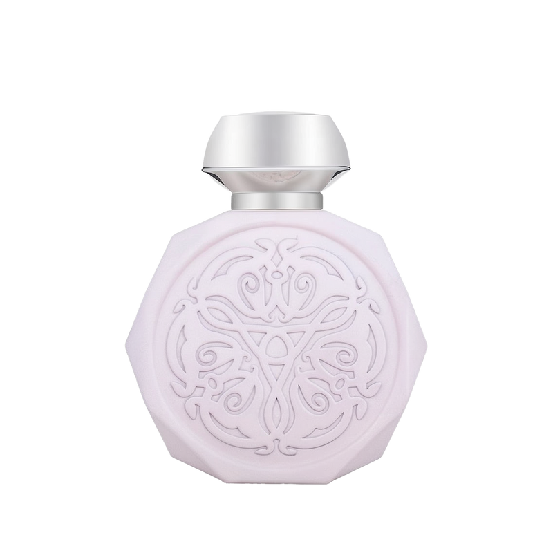 A pale pink, octagonal perfume bottle with intricate, embossed designs on the front. The bottle features a sleek, metallic silver cap that contrasts with the delicate design. The detailed pattern on the bottle adds an elegant and sophisticated touch to its overall appearance.