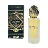 The image features a frosted glass perfume bottle with a golden ribbed cap and a black and gold packaging box. The box has an intricate geometric and arabesque design in black and gold, with the name "OUD FOR GLORY" and "BADEE AL OUD" prominently displayed, alongside the brand "Lattafa." The box also specifies "50ML / FRESH HAIR MIST / 1.7 FL.OZ." 