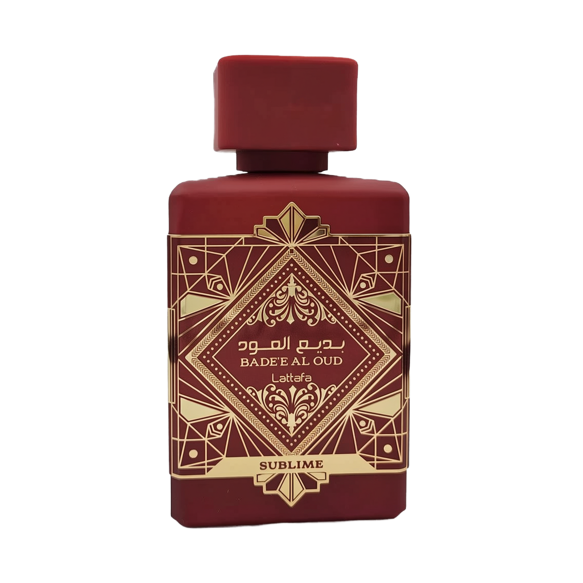 This image shows a deep burgundy perfume bottle with the name "BADEE AL OUD SUBLIME" from the brand Lattafa. The bottle has a matte finish with a matching square cap. It features a luxurious gold geometric pattern with traditional motifs, and the name is written in both Arabic and English. The word "SUBLIME" is displayed on a gold banner at the base. The design conveys a sense of rich heritage and sophistication.