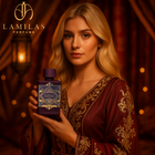 Blonde woman in ornate gown holding purple Bade’e Al Oud Amethyst perfume bottle.