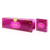 An image showcasing two boxes of "Bakhoor Anaqa" by Nabeel Perfumes. The boxes have a vibrant pink color with golden borders and arabesque patterns. The central label on each box has the product name "Bakhoor Anaqa" in both Arabic and English script within an oval gold-trimmed frame. The design conveys a sense of luxury and traditional Middle Eastern aesthetic. 
