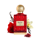 The image depicts a red glass perfume bottle with a golden, textured cap, labeled "Balas Rose" in English with Arabic script above it, suggesting the fragrance's name by the brand Ibraheem Al Qurashi.   In the composition, there's a red rose to the left, suggesting the scent's floral nature, vanilla beans to the left, indicating a warm, sweet note, a white flower (possibly vanilla or orchid) to the right, and a small pile of red saffron threads in the front right, hinting at the luxurious ingredients.