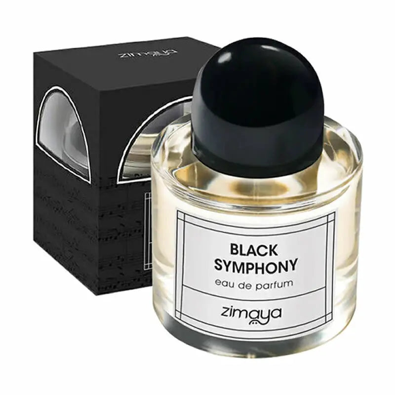 The image shows a bottle of "Black Symphony" eau de parfum by Zimaya alongside its packaging. The perfume bottle is clear glass, filled with a pale yellow liquid, and has a black cap. The white label on the bottle features black text that reads "BLACK SYMPHONY eau de parfum" with the brand name "zimaya" at the bottom. The accompanying black box has a sophisticated design with musical notes subtly printed on it and a clear window displaying the bottle inside.