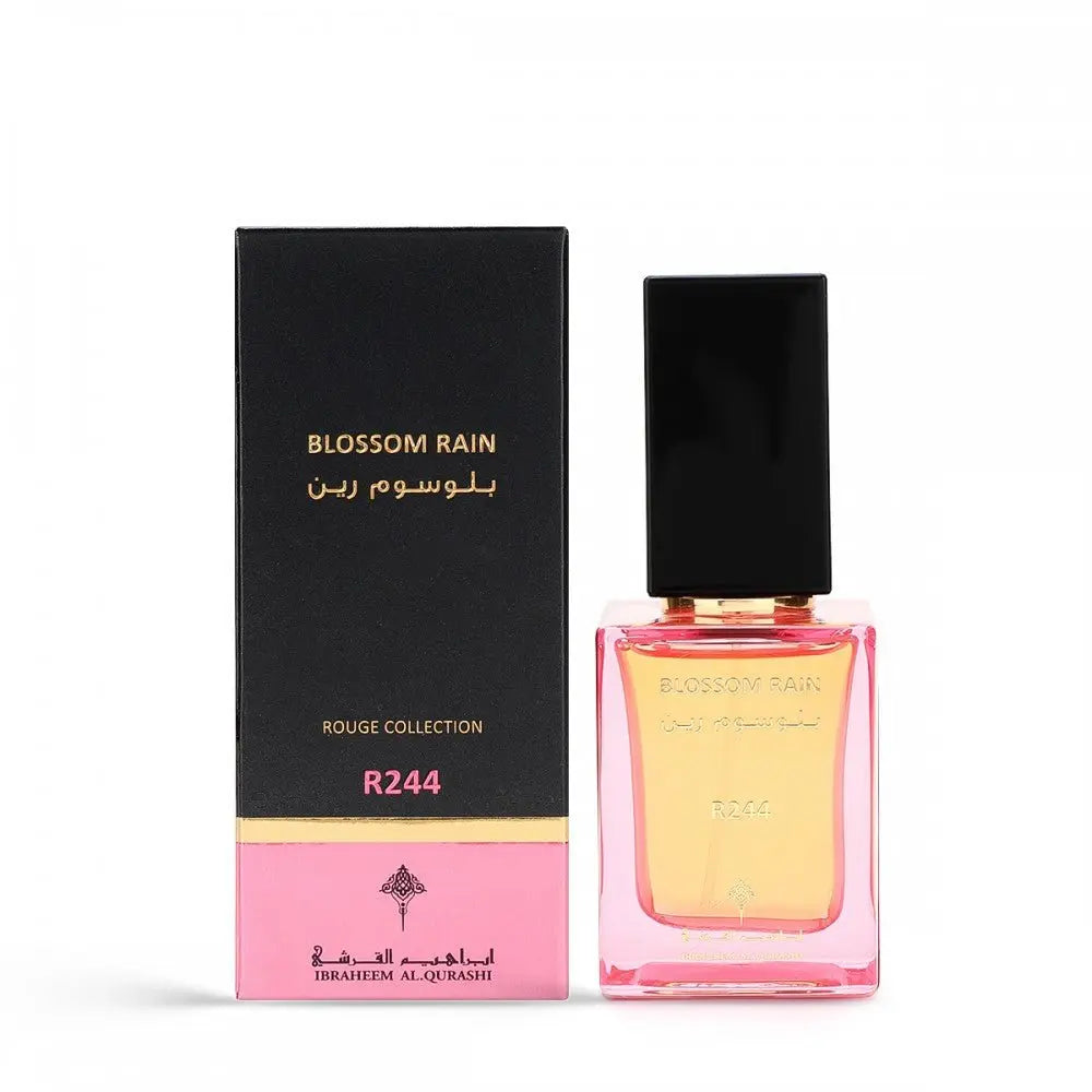 The image displays a perfume bottle and its packaging.  The brand's logo, Ibraheem Al Qurashi, is at the bottom of the box. The packaging's color scheme and elegant gold detailing suggest a luxurious and possibly floral-scented product. The white background accentuates the colors and design of both the bottle and the box.