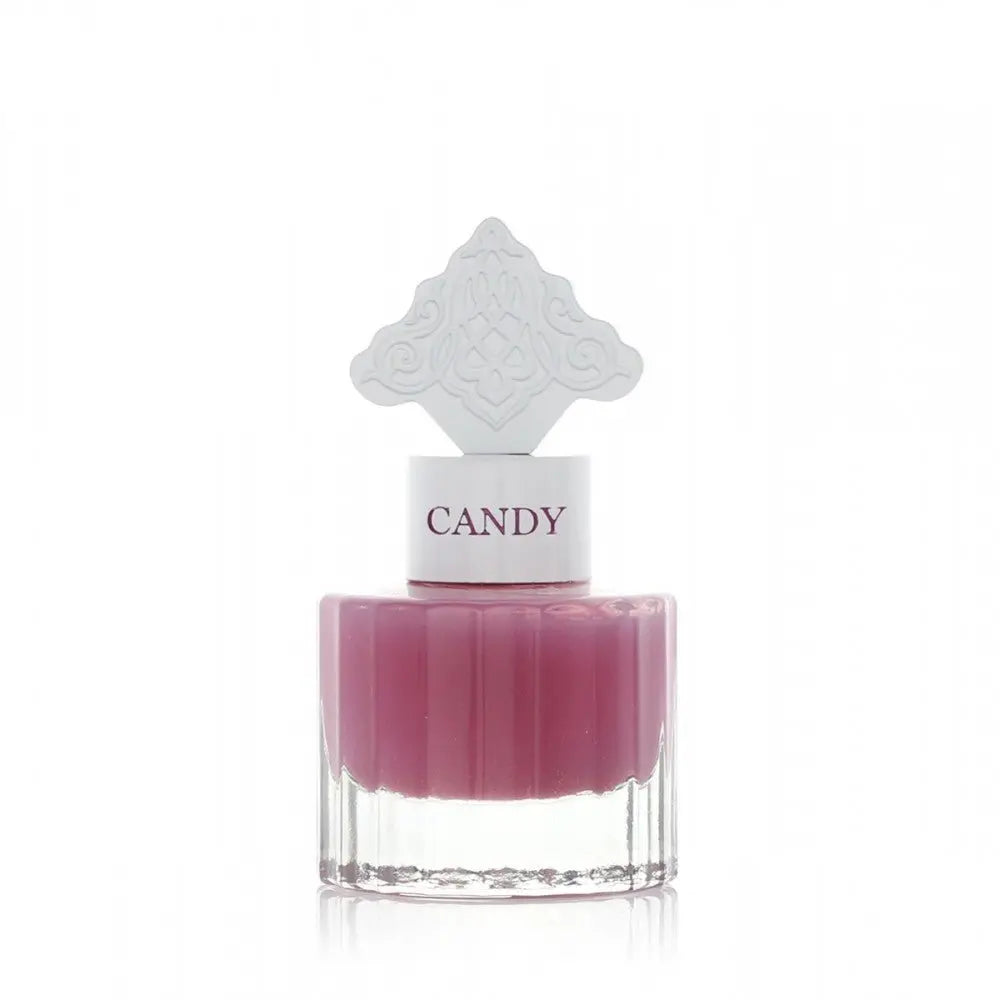  The image features a perfume bottle with a clear base and a purple-colored liquid. It has a white cap with the word "CANDY" printed on it in purple, matching the liquid's color. The cap is topped with a white ornate design that resembles an intricate architectural pattern, possibly inspired by Middle Eastern art.