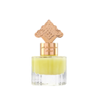 The image depicts a transparent perfume bottle with a yellow-colored liquid. The bottle is topped with a gold cap that has an ornate design, which may draw inspiration from Middle Eastern or Islamic art. The neck of the bottle features gold lettering in Arabic, likely indicating the name of the fragrance or the brand. The cap and the color of the liquid give the product a luxurious and exotic appearance, suggesting that it may be a cardamom-scented musk designed for use on hair.
