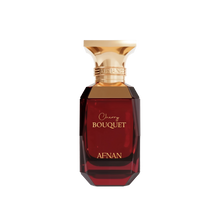 The image shows a perfume bottle named "Cherry Bouquet" by Afnan. The bottle is designed with a dark red, gem-like, faceted body and a gold-toned cap. The text "Cherry Bouquet" is written in elegant script, and the brand name "Afnan" is displayed in capital letters near the bottom of the bottle.