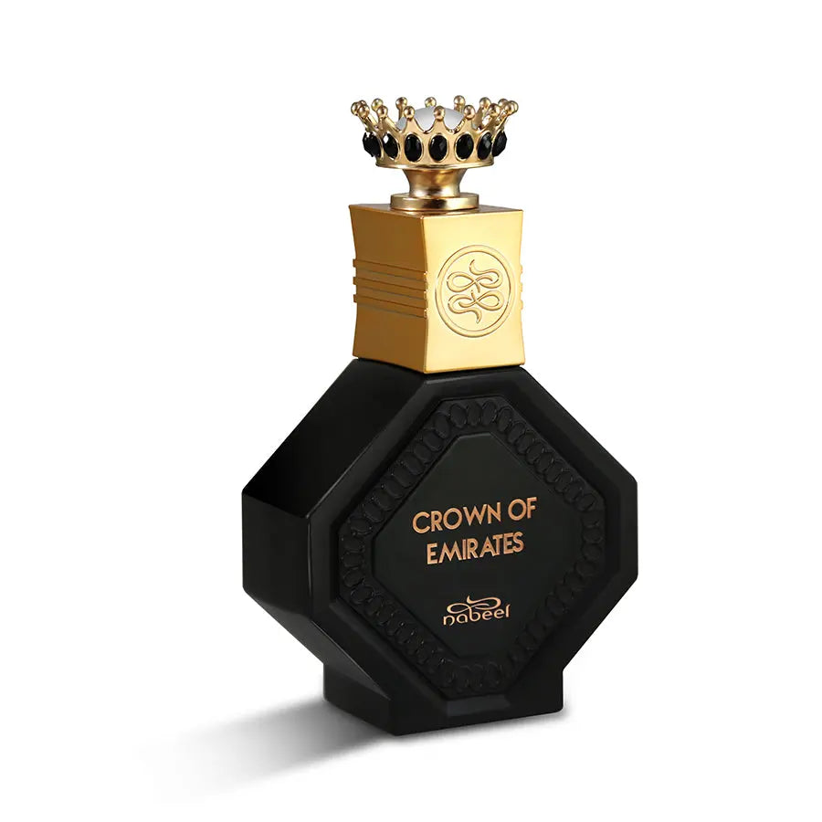 The image features a black perfume bottle with a hexagonal shape and a textured border around the label area. The bottle has a gold-colored cap with an embossed design, topped with a miniature crown that has black and gold accents. The label on the bottle reads "CROWN OF EMIRATES" in gold lettering, and the brand "nabeel" is displayed below.
