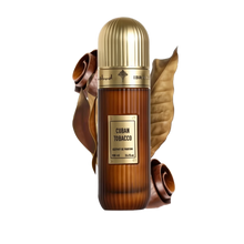 The image displays a bottle of "Cuban Tobacco" Extrait de Parfum by Ibraheem Al Qurashi. The fragrance bottle has a gradient brown design that simulates the look of a tobacco leaf, topped with a gold-colored cap. The label on the bottle is rectangular with the name of the scent prominently displayed in white against a dark background.