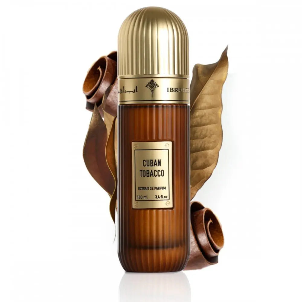 The image displays a bottle of "Cuban Tobacco" Extrait de Parfum by Ibraheem Al Qurashi. The fragrance bottle has a gradient brown design that simulates the look of a tobacco leaf, topped with a gold-colored cap. The label on the bottle is rectangular with the name of the scent prominently displayed in white against a dark background.
