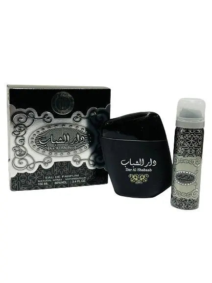 The image features two products against a white background. On the left is a box with intricate gray and white designs and Arabic script, also containing English text "Dar Al Shaabab", "Eau de Parfum", "Natural Spray", "100 ML", and "80% vol". Beside the box, there's a black perfume bottle with a rounded shape, displaying Arabic script and the name "Dar Al Shaabab" in English, matching the box's design.