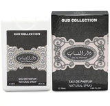 The image depicts two boxes from the OUD COLLECTION of perfumes. On the left is a white box and on the right is a black box, both featuring the same intricate design with a central label that includes Arabic script and the English text "Dar Al Shaabab". Below the label, both boxes have additional English text stating "Eau de Parfum Natural Spray" and the volume "20ml 0.65 FL.OZ". The design is ornate with a mix of dark and light gray patterns and swirls, giving the packaging a luxurious look.