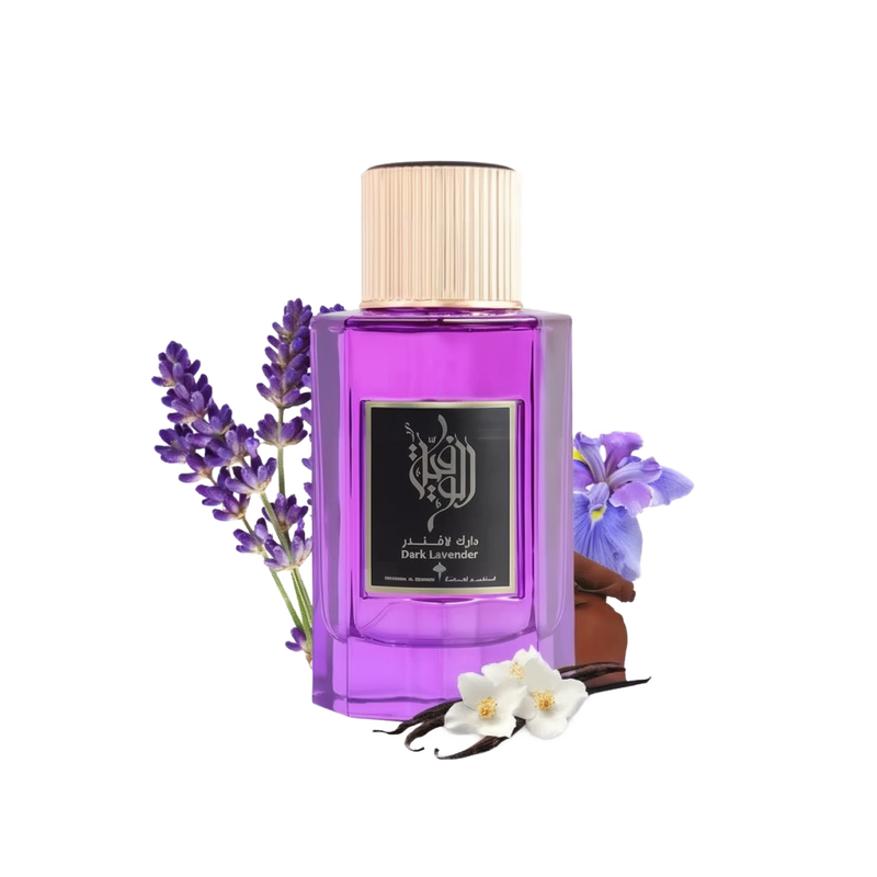 The image features a bottle of "Dark Lavender" perfume by Ibraheem Al Qurashi. The bottle is made of glass with a vibrant purple color and is capped with a gold-colored top. The front label has Arabic calligraphy and the name of the scent in English. Adjacent to the bottle are sprigs of purple lavender, a few vanilla pods, and white flowers, which are likely to be part of the fragrance's notes.