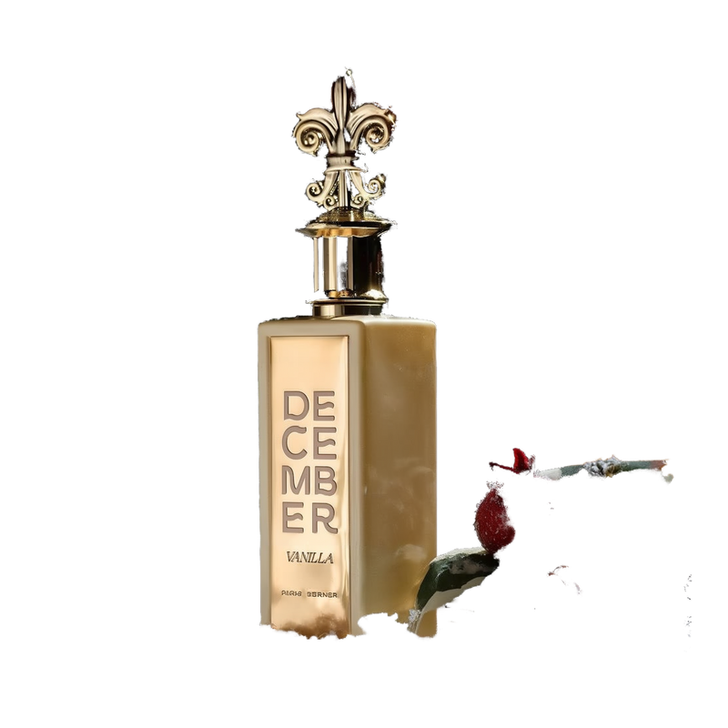 A luxurious perfume bottle standing upright on a snowy surface. The bottle is golden, with the name "December Vanilla" engraved vertically on the front. It features a decorative gold 