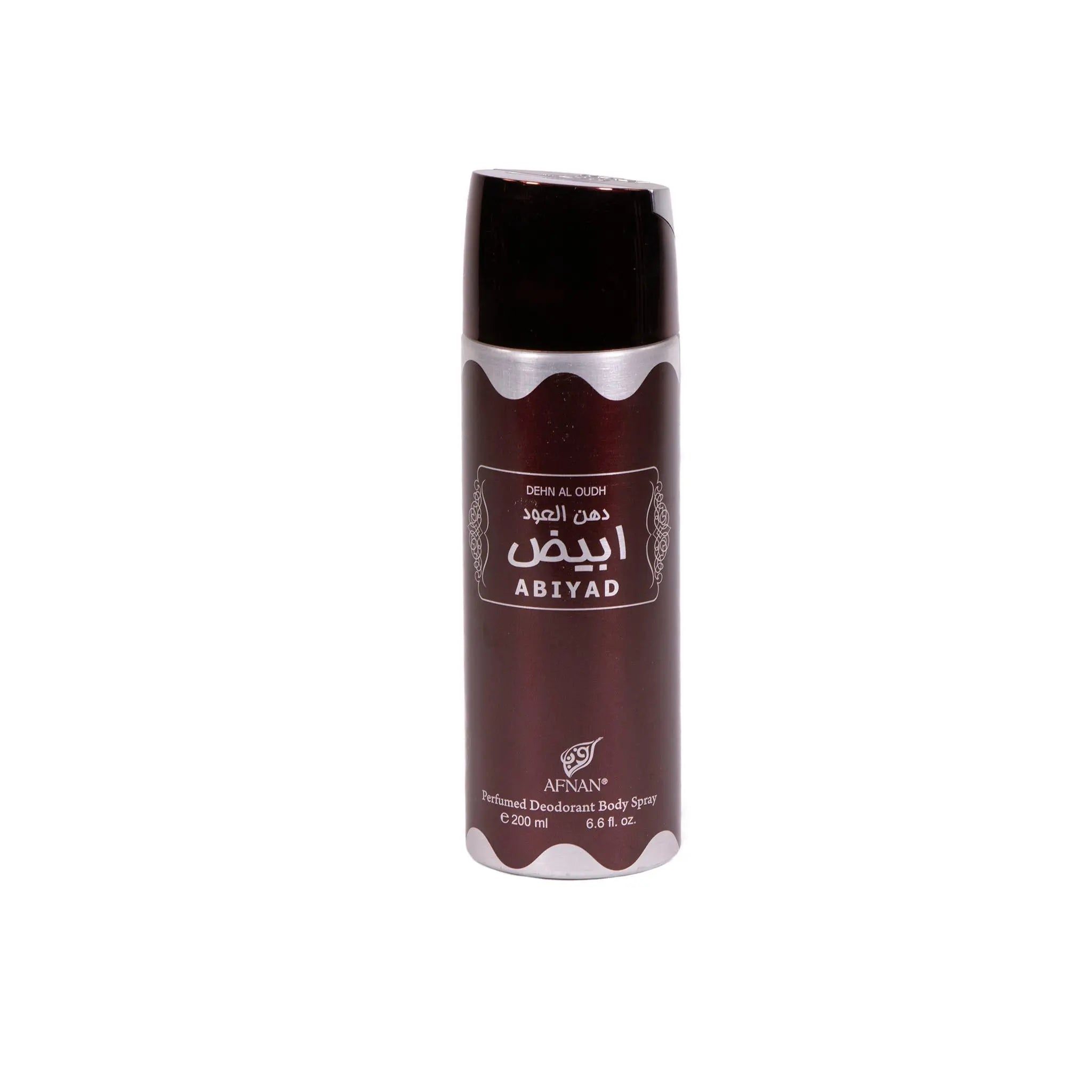 The image features a cylindrical deodorant body spray can. It has a dark brown color with a silver accent around the middle. On the front, there's an ornamental label with the words "DEHN AL OUDH ABIYAD" in English, along with Arabic calligraphy that likely mirrors the product name. Below the script, the brand name "AFNAN" is printed. Additional product information indicates that it is a "Perfumed Deodorant Body Spray" and contains "E 200 ml 6.8 fl. oz." 