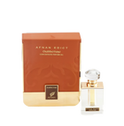 The image shows a perfume product consisting of a rectangular glass bottle and its packaging. The bottle, placed to the right, has a clear liquid with a golden neck and a large, transparent, faceted cap. On its front, there's a label with "AFNAN EDICT Ouddiction" in black letters on a gold background. To the left is the box, in a gradient of brown to gold with a subtle paisley design, and it reads "AFNAN EDICT Ouddiction CONCENTRATED PERFUME OIL" in gold embossed letters. 