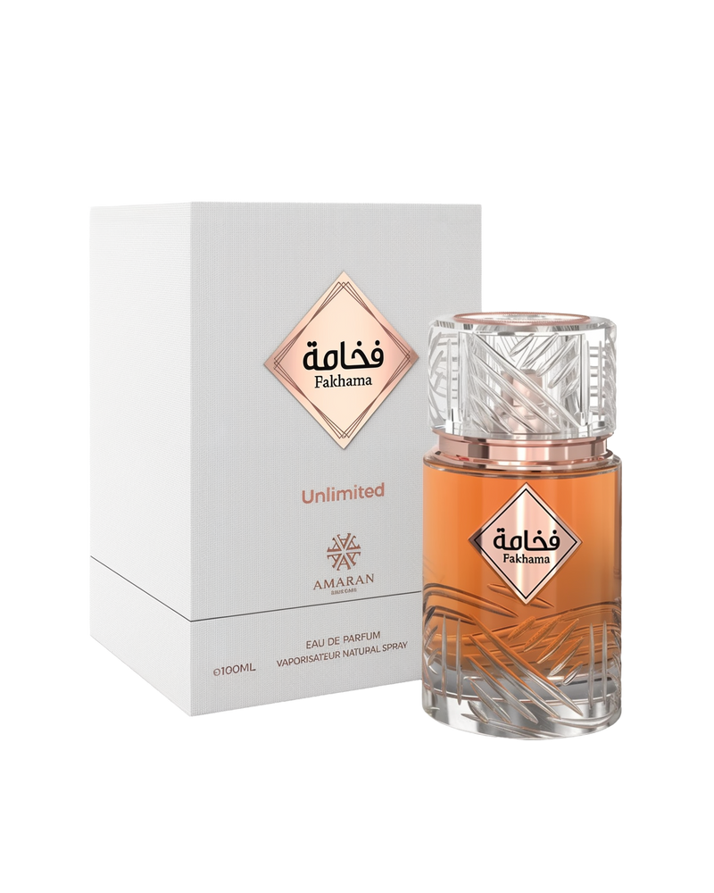 Fakhama Unlimited perfume by Amaran in a carved glass bottle with rose-gold accents, next to a white and rose box.