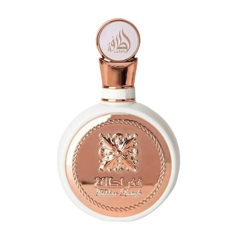 The image features a round, flat white perfume bottle with a rose gold cap and intricate rose gold detailing on the front. The central design is an ornate butterfly, surrounded by a braided border, with the name "Fakhar Lattafa" written below. The cap has the brand's logo "Lattafa" in stylized Arabic calligraphy. The aesthetic suggests a feminine and elegant fragrance product.