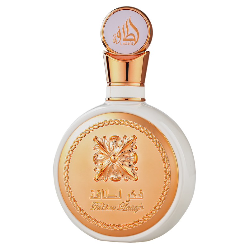 Elegant Fakhar Lattafa perfume bottle, white with a rose gold metallic cap and ornate golden relief detailing on the front.