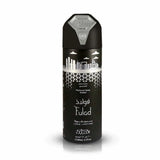 An image of a tall, sleek black deodorant spray bottle with a distinctive design. The upper part of the bottle features a white silhouette of a city skyline with buildings and clouds against a black background. Below the skyline, "Fulad" is written in large, stylized white lettering with Arabic script above it, suggesting the name of the fragrance. The label indicates that it is a "Perfumed Spray Unisex" and boasts of being "Long Lasting".