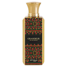 Zimaya Grandeur Eau de Parfum gold bottle with a bold, colorful red, green, and black geometric pattern.