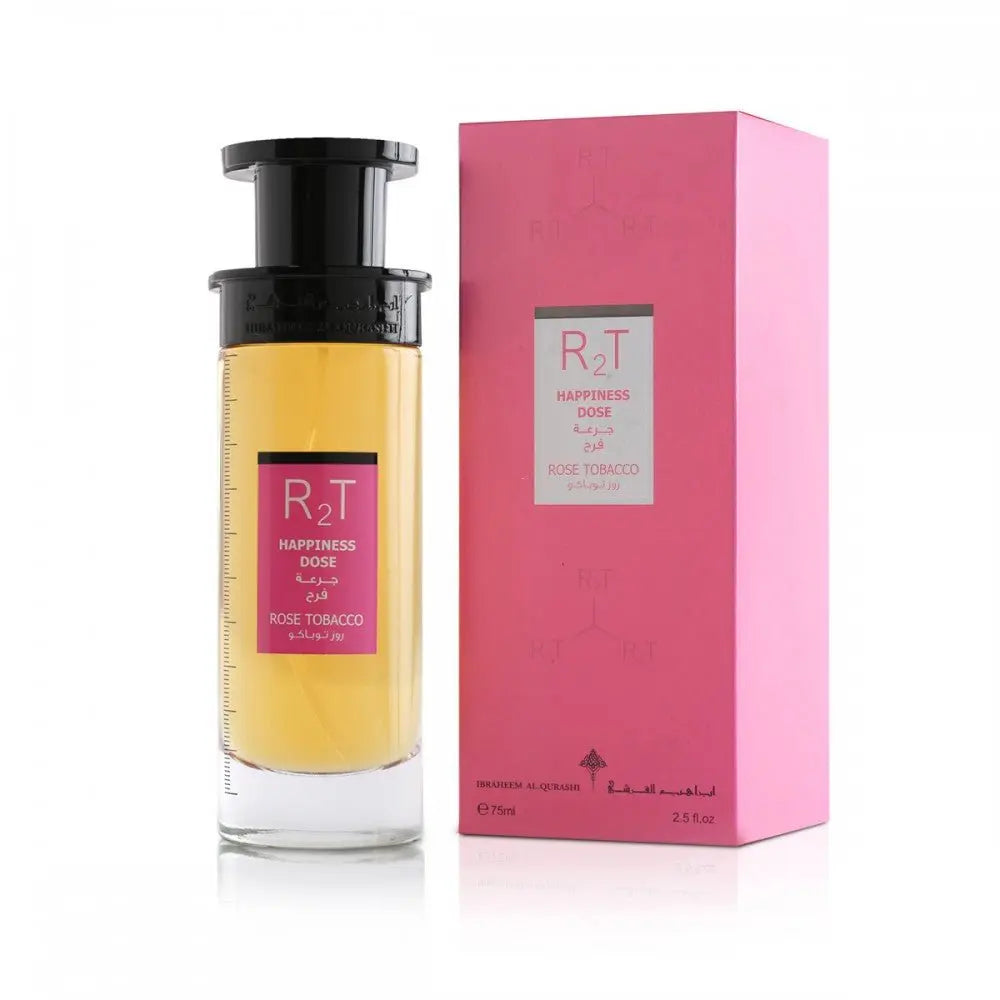 This image displays a clear cylindrical perfume bottle with a black pump and a yellowish liquid inside, next to its pink packaging. The bottle has a label with "RT" at the top, "HAPPINESS DOSE" in both English and Arabic, and "ROSE TOBACCO" at the bottom. The pink packaging box repeats the label design and includes additional embossed "RT" initials and the Ibraheem Al Qurashi logo at the bottom, along with the size information "75ml / 2.5 fl.oz." 