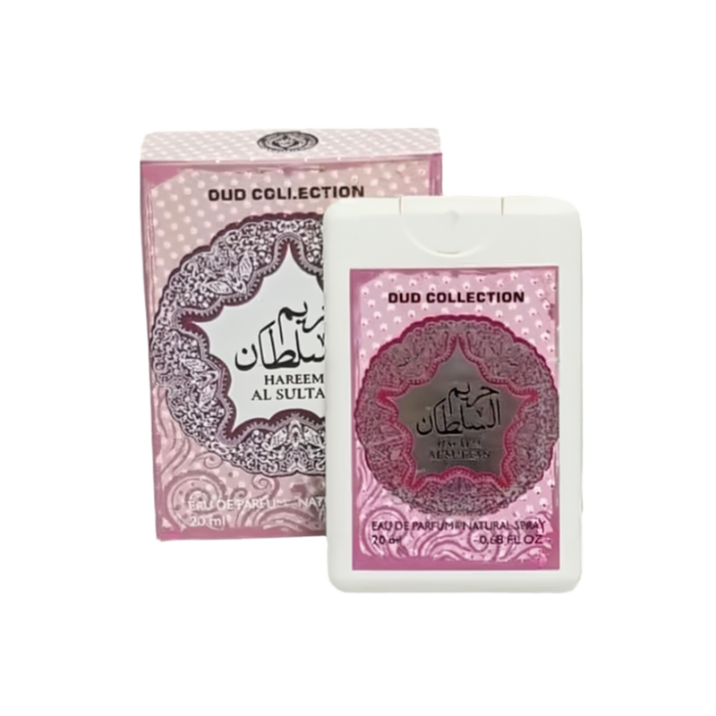  The image shows a product from the "OUD COLLECTION" named "HAREEM AL SULTAN." It includes a pink and white box with intricate lace-like patterns and Arabic calligraphy, alongside a matching white plastic container with a clear window that displays a smaller item inside, possibly a perfume bottle. Both the box and the container feature the same design elements and mention "Eau de Parfum Natural Spray" and the volume "20ml 0.68 FL.OZ." 