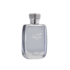 A close-up of the HAWAS For Him perfume bottle by Al Rasasi. It's a clear, rectangular glass bottle with rounded edges, filled with a light blue tinted liquid. The bottle features elegant white Arabic and English lettering that reads "HAWAS For Him." The cap is a textured silver, resembling a coiled rope design, which adds a sophisticated touch. The base of the bottle also has a delicate, white Arabic script logo.