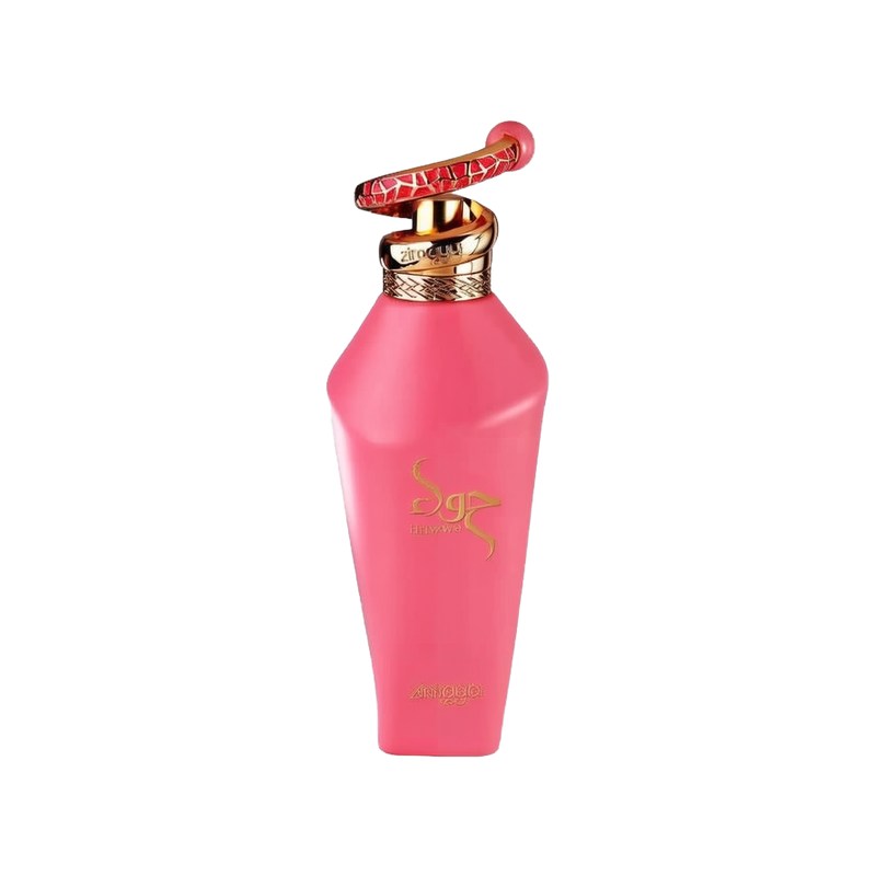The image shows a close-up of a perfume bottle without its packaging. The bottle has a bright matte pink finish with gold accents. The cap is particularly distinctive, featuring a gold ring and a red and gold patterned design that extends upwards, resembling a handle or decorative element. The front of the bottle is adorned with the brand's name in a golden, stylized script, and the word "zimaya" is printed beneath it in a smaller font. The design elements suggest a feminine and luxurious fragrance product.