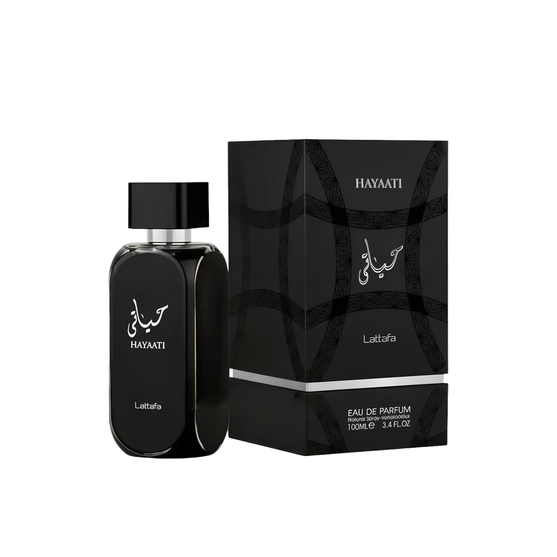 The image shows a black bottle of perfume from Lattafa with the name "Hayaati" written in both Arabic and English on the front. The bottle has a sleek, rectangular design with rounded edges and a silver ring around the neck. The packaging box, also black,