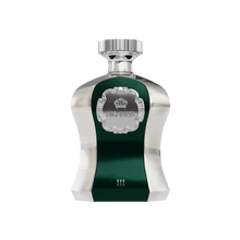 The image shows an elegant perfume bottle from Afnan Perfumes, part of the "Highness" series, featuring a deep green central panel surrounded by a metallic silver body with a textured finish. The front panel has the word "HIGHNESS" framed within a silver ornate border, under a crown symbol, indicating the regal nature of the scent. A polished silver cap sits on top of the bottle, and the number "III" is marked at the bottom of the green panel.