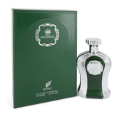 The image features a green perfume bottle with a textured silver surface and a matching green box. The box displays the brand logo "AFNAN" and the product name "His HIGHNESS" inside an ornate, circular crest with a crown symbol, indicating a royal theme. The bottle has a similar crest embossed on it and a silver cap. Text on the box specifies the product as "Eau de Parfum Vaporisateur" and indicates the quantity as "100ML 3.4 FL.OZ."