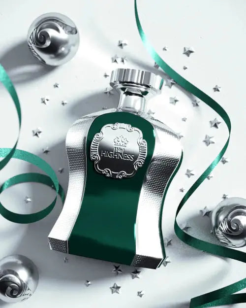 The image shows a luxurious perfume bottle from the "Highness" collection, featuring a shimmering silver and deep green design. The bottle is adorned with a silver label engraved with "HIGHNESS" and a royal crown motif. It is set against a festive background with silver stars and green ribbons, suggesting a holiday or celebratory theme. The overall composition conveys a sense of opulence and festivity, possibly indicating that the perfume is a special edition or part of a holiday collection. 