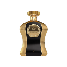 A photo of the Highness V Black EDP 100ml perfume bottle, featuring a striking contrast of polished gold and deep black. The central black panel is framed by a textured gold surface with a luxuriously designed crest bearing the name 'HIGHNESS' above and the Roman numeral 'V' below. The cap is a smooth gold that complements the elegance of the bottle design, suggesting a scent of regal and sophisticated character.