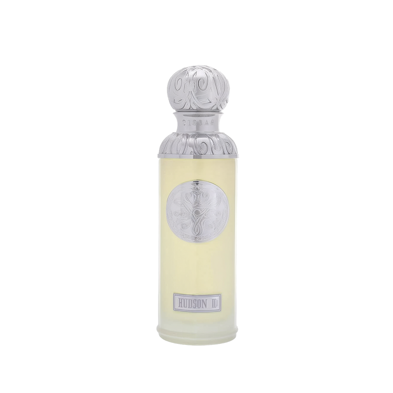 he image features a perfume bottle named "Hudson II" from the Gissah collection. The bottle is a light, almost translucent yellow with a tall cylindrical shape. It has a detailed silver cap and a silver medallion on the body, both featuring intricate embossed designs. The name "Gissah" is inscribed on the neck of the bottle, and "HUDSON II" is displayed on a plaque at the bottom.