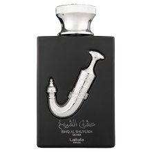 Black Lattafa Ishq Al Shuyukh Silver perfume bottle with silver dagger design.