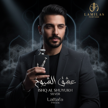 Man holding Lattafa Ishq Al Shuyukh Silver perfume bottle with smoky backdrop.