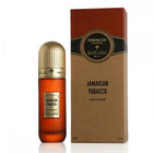 This image displays a tall, cylindrical amber-colored perfume bottle with a golden cap, labeled "Jamaican Tobacco" by Ibraheem Al Qurashi. The label shows "Extrait de Parfum" and the volume "100 ml / 3.4 fl.oz." To the right is the packaging, a rectangular box with a kraft paper texture and brown upper section, including the text "TOBACCO COLLECTION" in a circular emblem and the Ibraheem Al Qurashi logo.