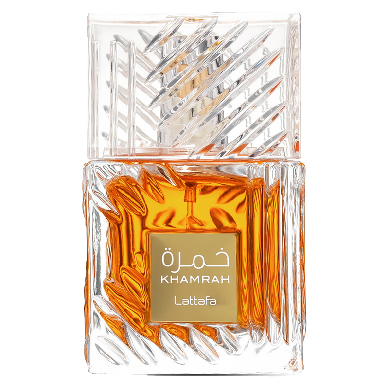 Lattafa Khamrah fragrance in a faceted clear glass bottle filled with rich amber liquid and featuring a gold label.