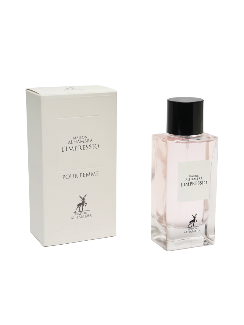 A product image of Maison Alhambra’s “L’Impressio Pour Femme” perfume: a tall, rectangular off-white gift box printed in simple black serif font with “Maison Alhambra L’Impressio” at the top, “Pour Femme” beneath, and a small stylized stag logo above “Maison Alhambra” at the bottom. Beside it stands a clear rectangular glass bottle filled with pale pink fragrance, topped by a glossy black cylindrical cap.