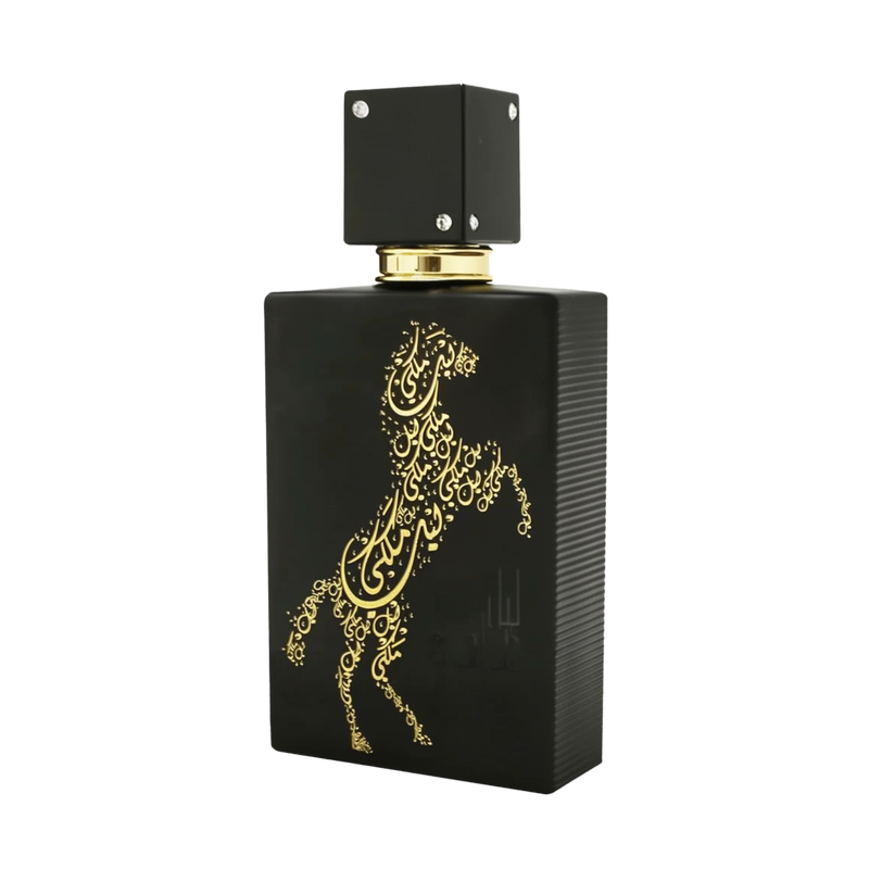 A sleek black bottle of Lail Maleki Eau de Parfum by Ard Al Zaafaran, featuring an elegant gold design of a rearing horse made up of intricate Arabic calligraphy. The bottle has a textured finish and a square black cap adorned with small silver accents. The luxurious and artistic design of the bottle highlights the sophistication and exclusivity of the fragrance.