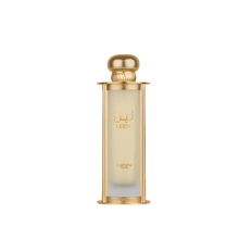 The image shows a perfume bottle named "Leen" by Lattafa Pride. The bottle is cylindrical with a transparent glass body that has a gold gradient starting from the top, and it is supported by a gold base and topped with a matching gold cap. The name "LEEN"