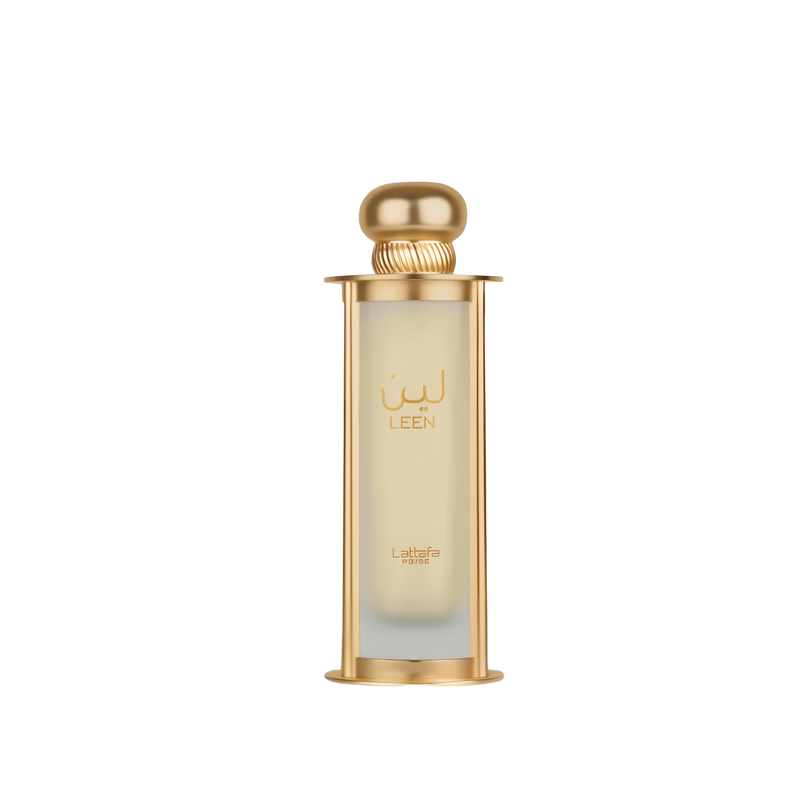 The image shows a perfume bottle named "Leen" by Lattafa Pride. The bottle is cylindrical with a transparent glass body that has a gold gradient starting from the top, and it is supported by a gold base and topped with a matching gold cap. The name "LEEN"