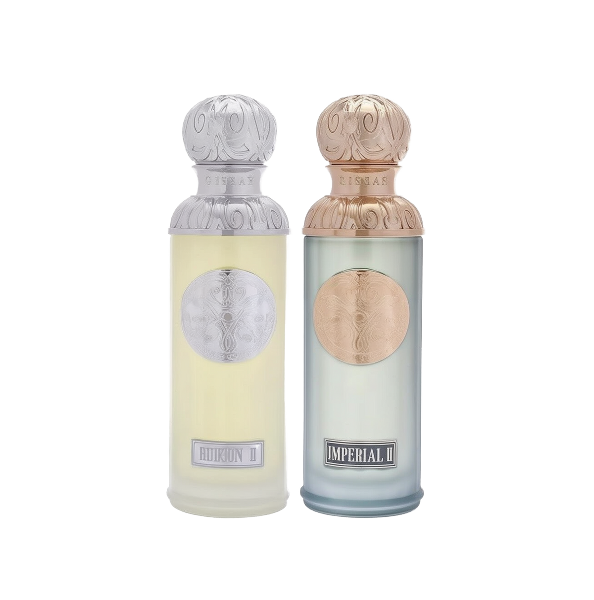 The image features two perfume bottles from the Gissah collection, "Hudson II" and "Imperial II." Both bottles have tall, cylindrical shapes with ornate silver caps featuring embossed designs. "Hudson II" has a light yellow tinted glass body with a silver medallion, and "Imperial II" has a light blue tinted glass body with a copper medallion. Each bottle is labeled with its respective name in elegant font at the bottom. 