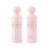 The image features two light pink perfume bottles from the "Legend of the Sky for Her" collection by Gissah, named "Sora" and "Ellora." The bottles have a cylindrical shape with detailed ornamental designs embossed on the silver caps and the central gold medallions. The names "Sora" and "Ellora" are inscribed on gold plaques at the base of each bottle. 