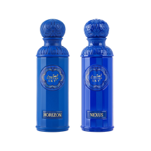 The image displays two perfume bottles from the "Legend of the Sky" collection by Gissah, named "Horizon" and "Nexus." Both bottles are vibrant blue with a tall, cylindrical shape and an ornate, embossed cap. The front of each bottle features an ornamental gold emblem with the collection's name, "GISSAH SKY," and each has a gold label with the individual fragrance's name. 