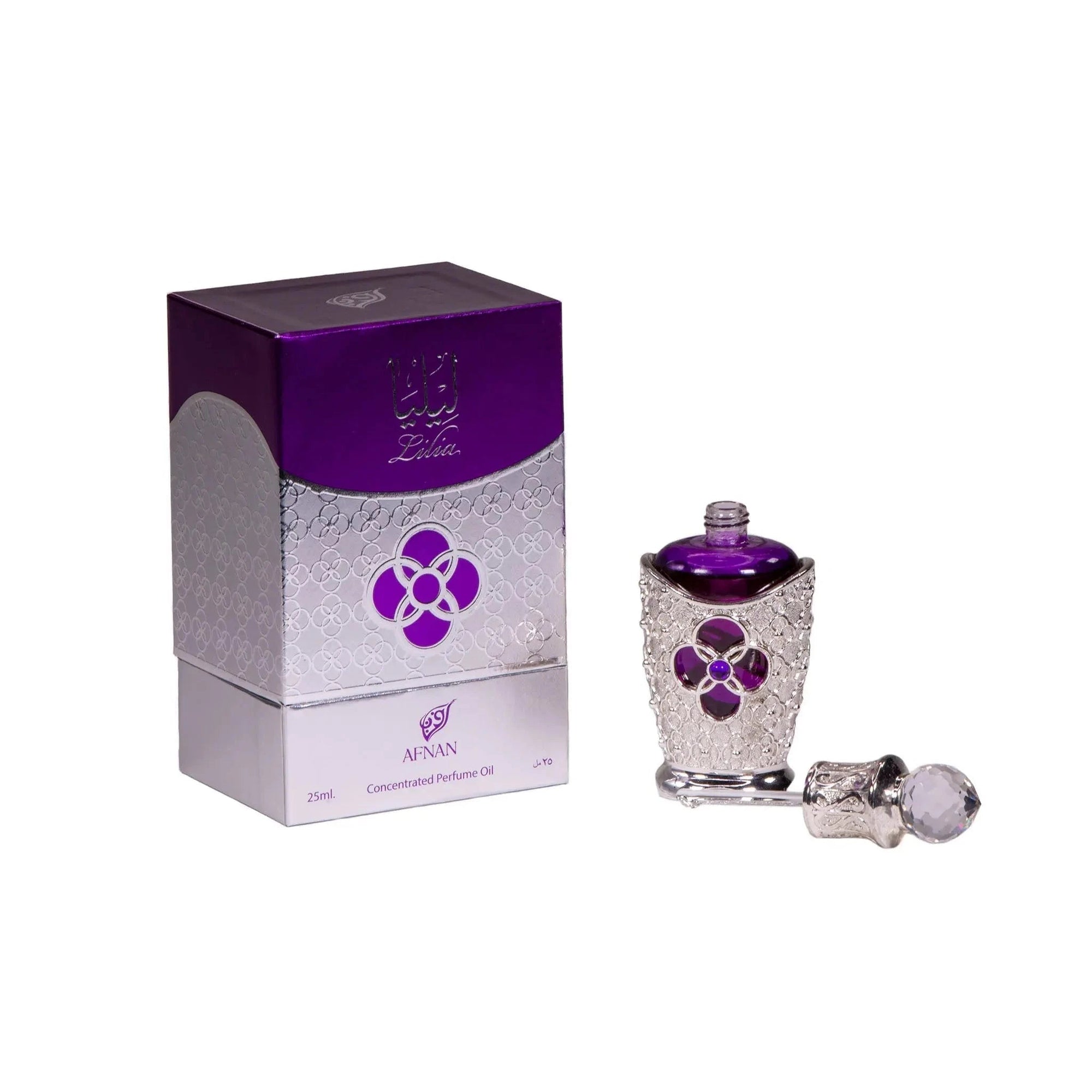 The image showcases the Lilia Concentrated Perfume Oil by Afnan along with its box. The perfume bottle is intricately designed with a silver pattern and a purple floral jewel, capped with a clear faceted stopper. The box reflects the elegance of the bottle with a silver and purple color scheme and features the Afnan logo. The image presents the product as a luxurious and opulent item, perfect for collectors and connoisseurs of fine Middle Eastern fragrances.