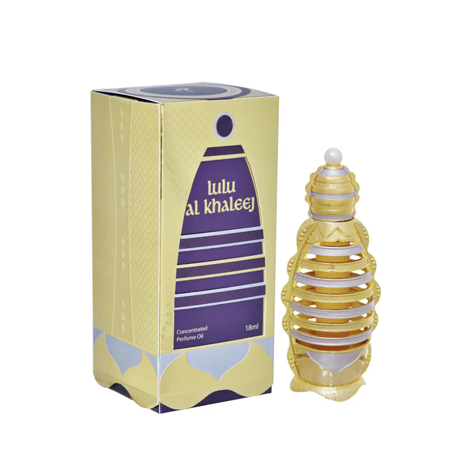 The image shows a product called "Lulu Al Khaleej" by Khadlaj, which is a concentrated perfume oil. The product is packaged in an 18ml bottle. The packaging box is predominantly gold with purple accents and features the product name in English and Arabic.